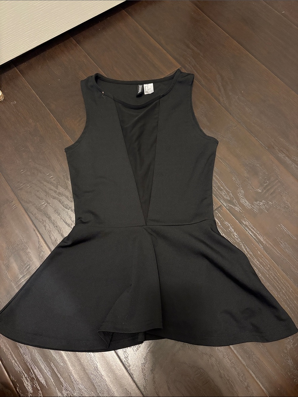 Black Sleeveless Peplum Top with Mesh V-Panel
